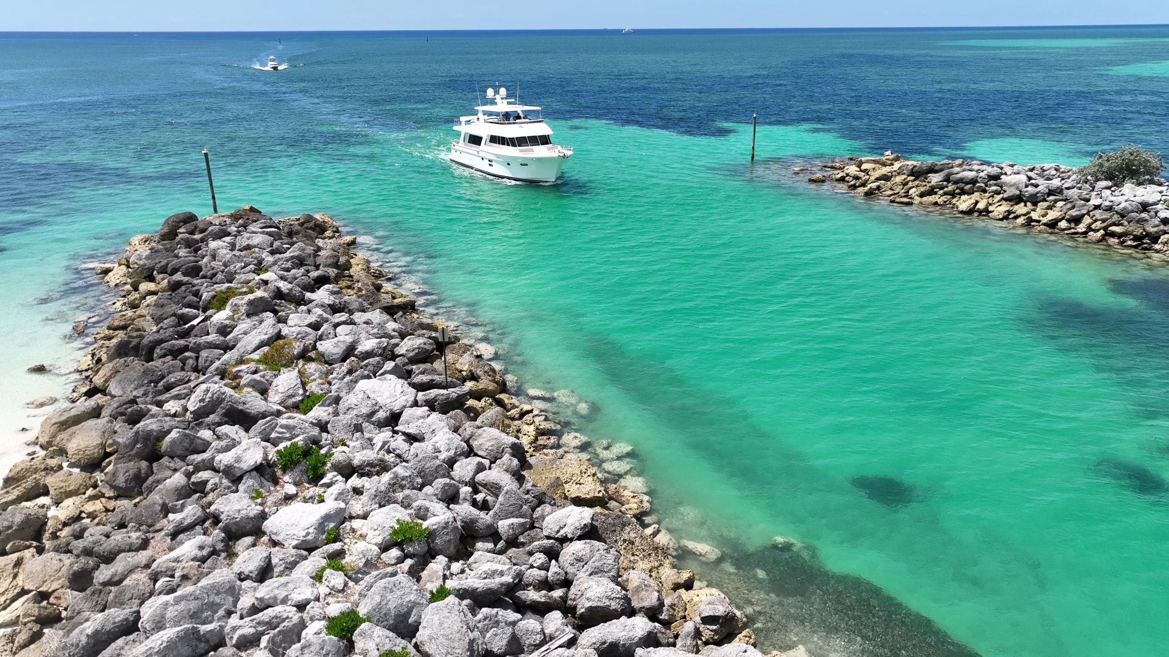 A motor yacht coming in through the cut at Port Lucaya, Grand Bahama