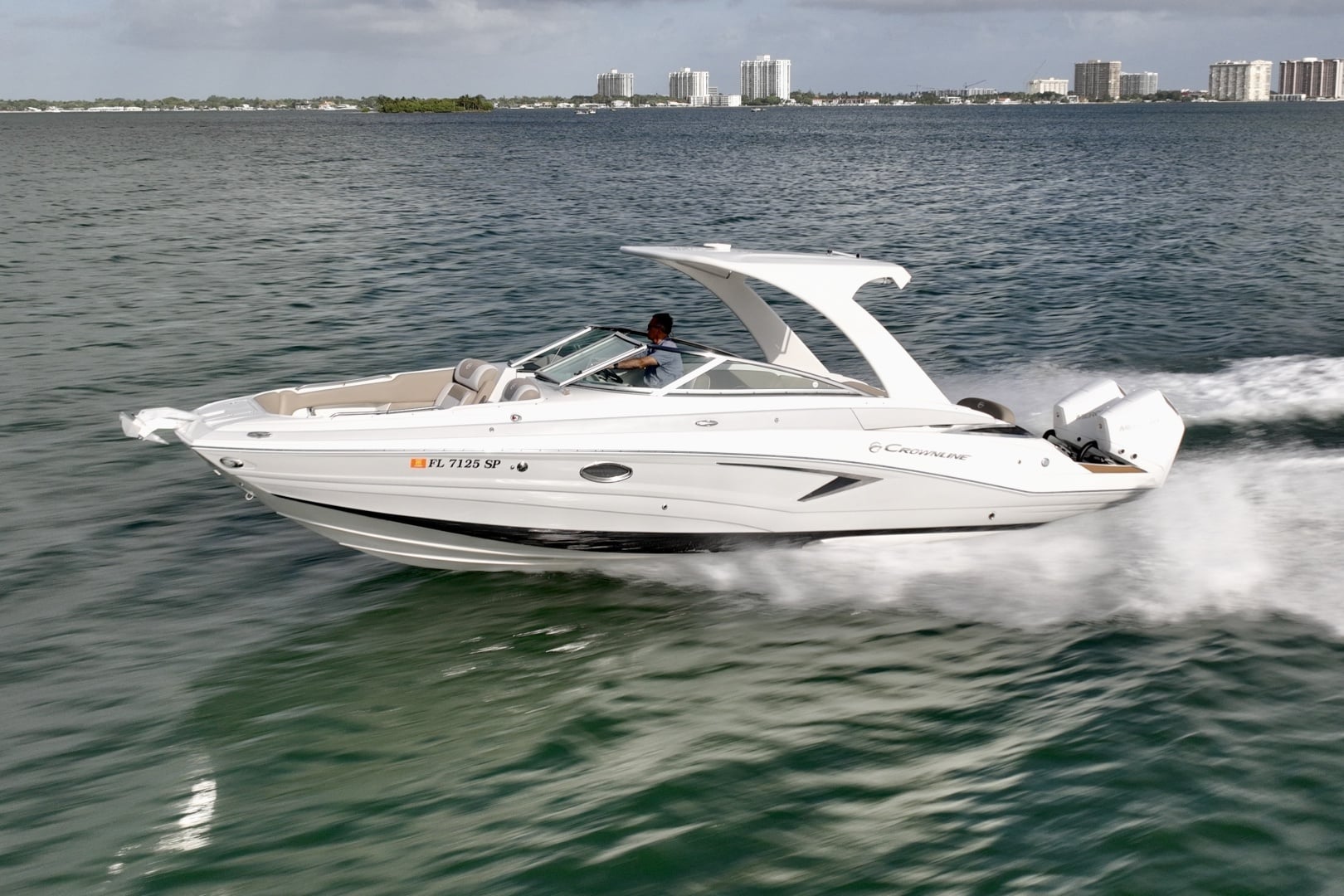The 2020 Crownline E305 XS underway off North Miami