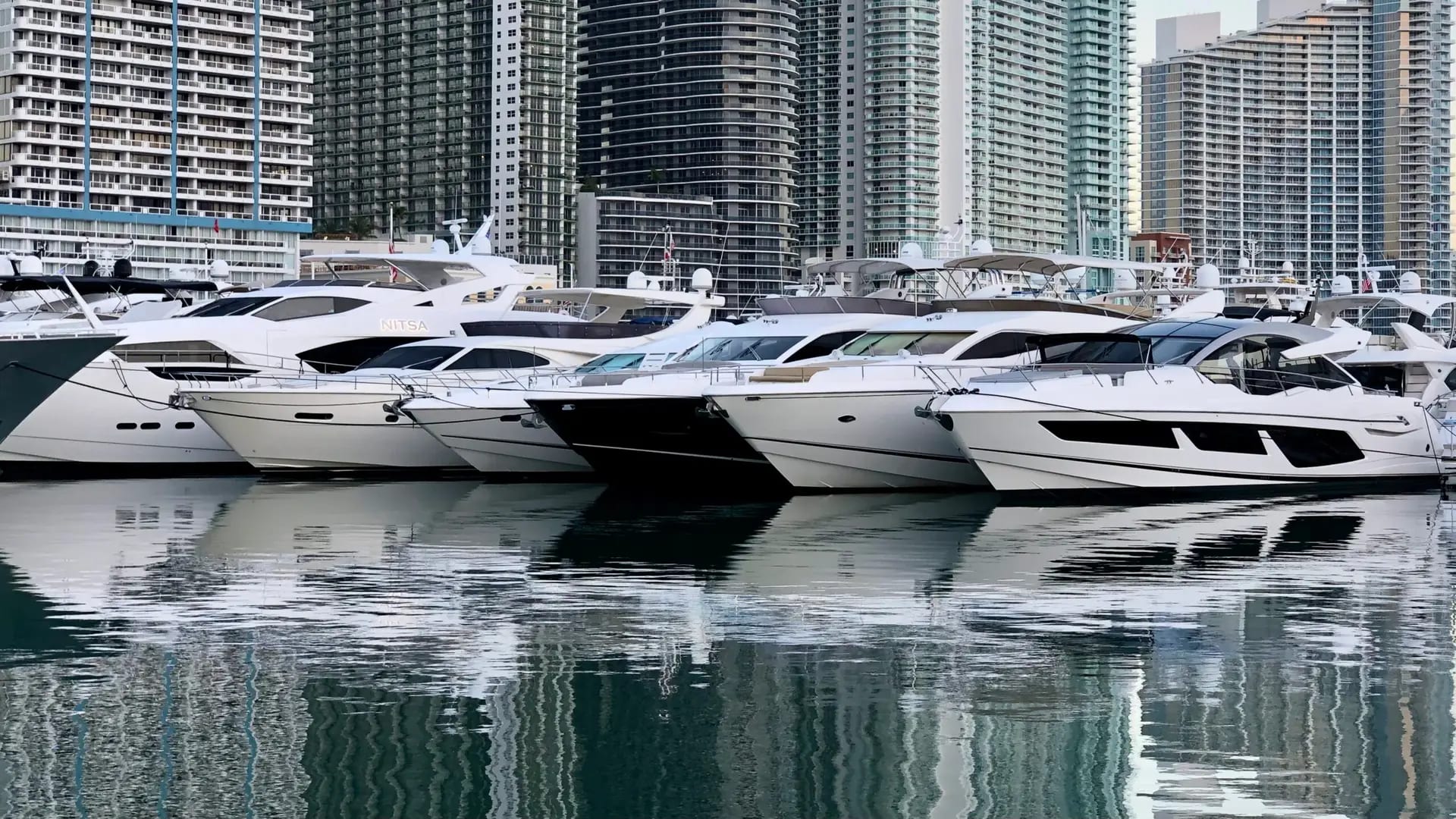 Yachts lined up stern-to at a boat show